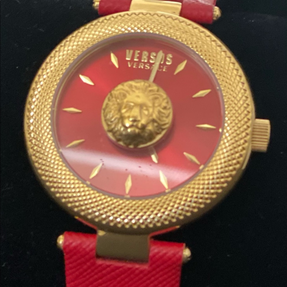 VESACE RED LEATHER GOLD FACE WATCH.